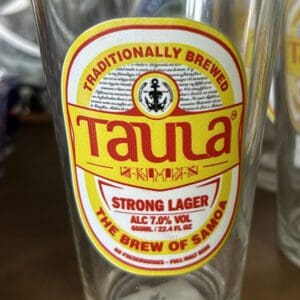 Beer glass with Taula Strong Lager label.