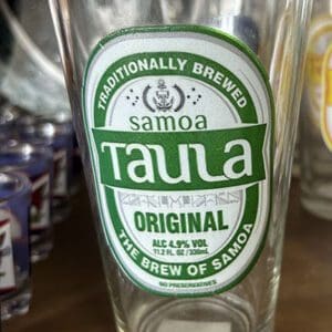 Glass with Taula beer label design.