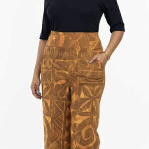 Woman in off-shoulder top and wide-leg patterned pants