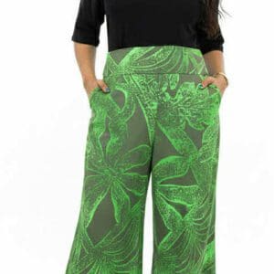 Plus-size model wearing green patterned palazzo pants