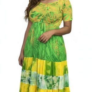 Woman in green and yellow patterned maxi dress