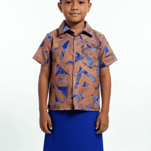 Boy wearing patterned shirt and blue skirt