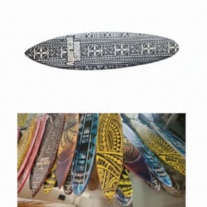 Colorful Polynesian-patterned surfboards hanging in shop