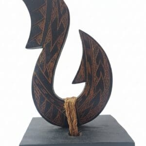 Carved wooden abstract sculpture with geometric patterns