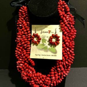 Multi-strand red bead necklace with earrings